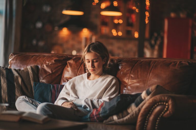 Portrait of candid authentic dreamer boy teenager in sadness depressing emotion at home Xmas