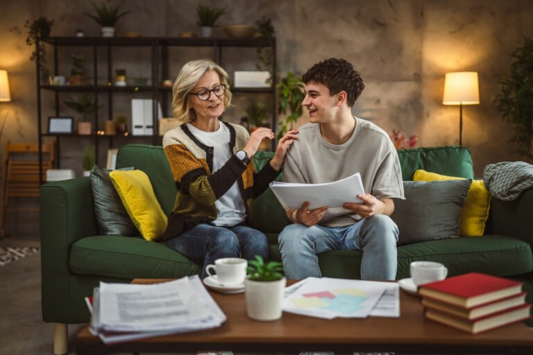 student caucasian man study with help of his tutor professor or mother