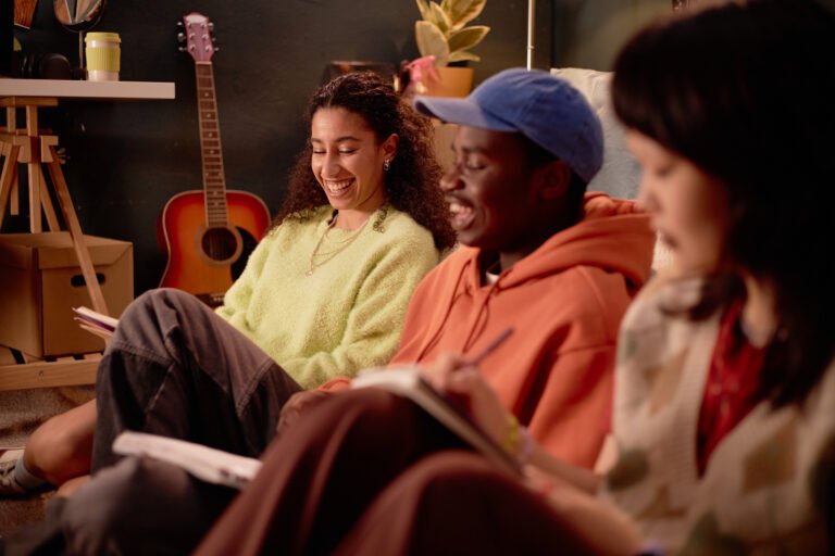Smiling Friends Gathering and Writing Journals Together