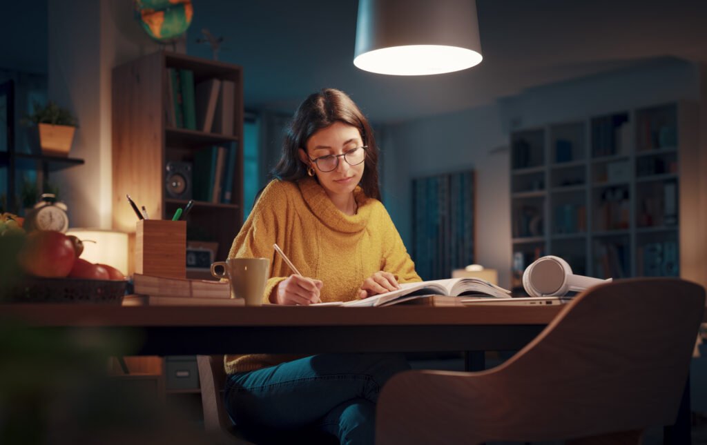 Young woman studying late at night
