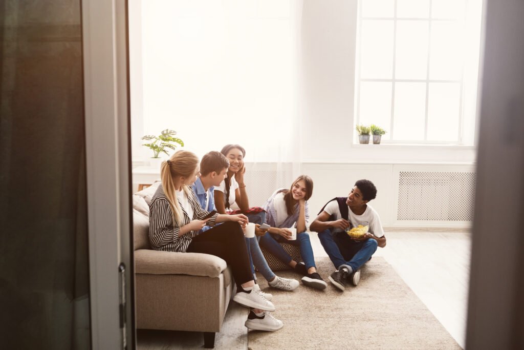 Happy students spending time together and talking