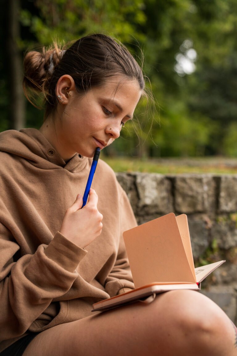 Close-up portrait of a woman drawing.