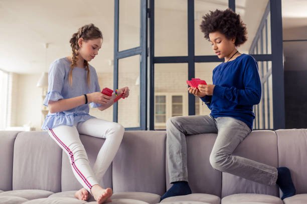 Your term. Serious brunette boy bowing head while going to start game