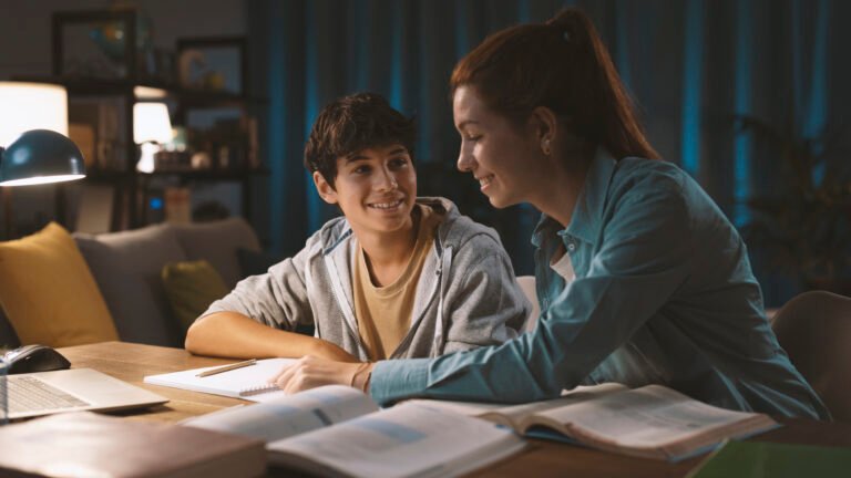 Tutor helping a student with his homework