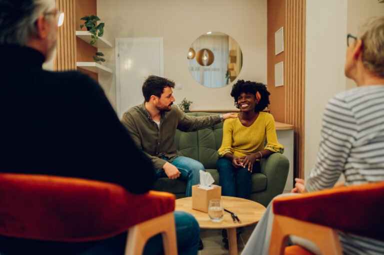 Multiracial people talking about their mental health on a group therapy session