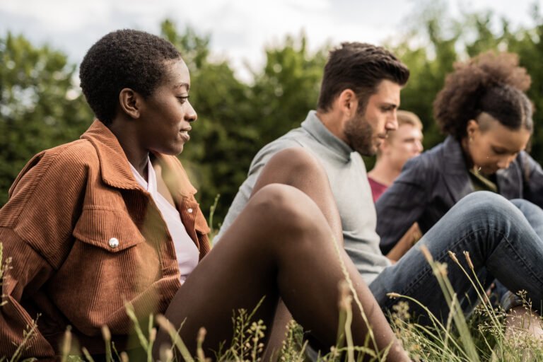 Portrait of multiethnic young people at picnic in the park
