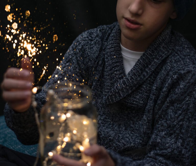 Kid with a jar full of lights in his hands