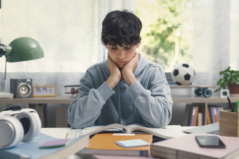 Smart student reading books at home
