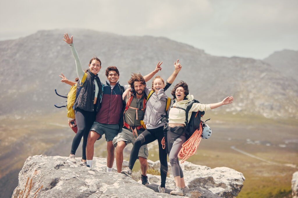 Hiking goals, mountains and friends portrait for fitness, adventure or wellness lifestyle. Nature, eco and health people or group with happy motivation for backpack trekking and countryside journey