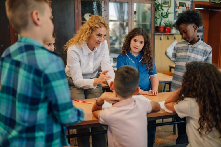 Elementary school teacher explaining lesson to her students