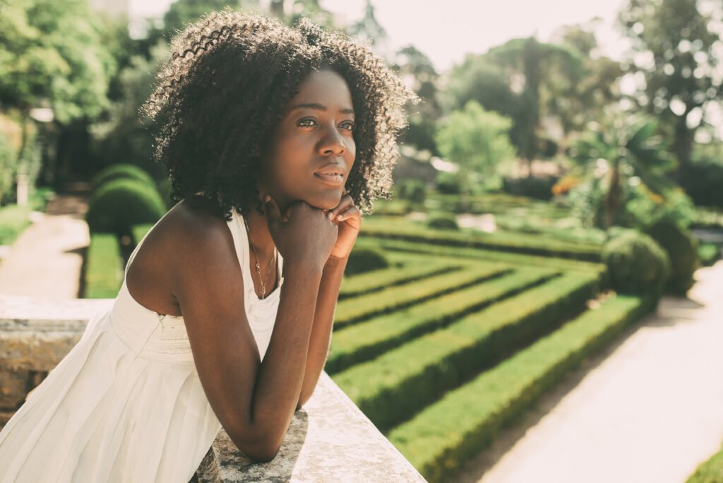 Dreamy Pretty Black Woman Relaxing in Park