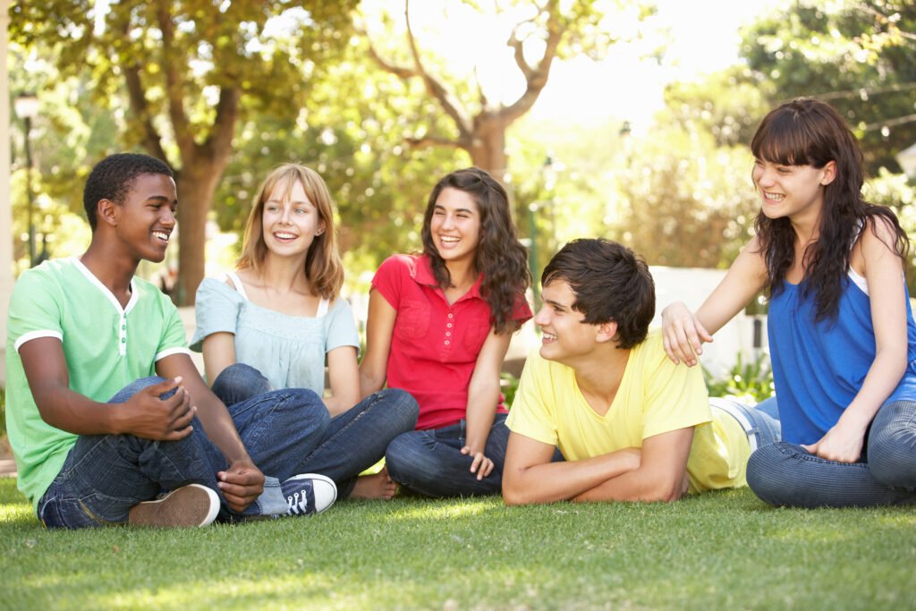 Teenagers Chatting Together In Park