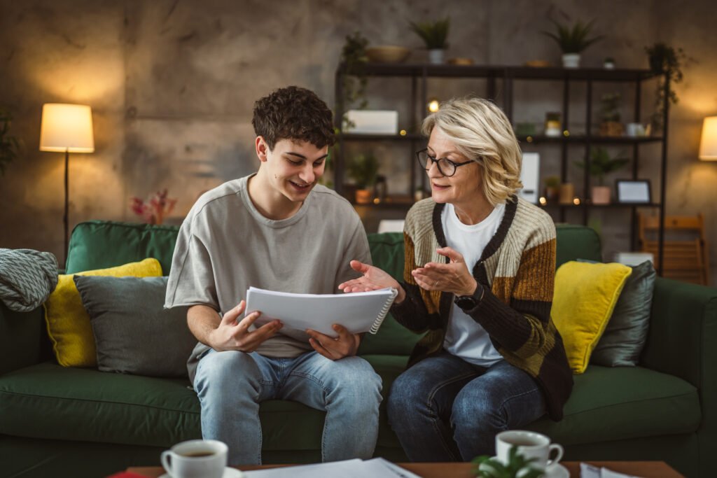 student caucasian man study with help of his tutor professor or mother