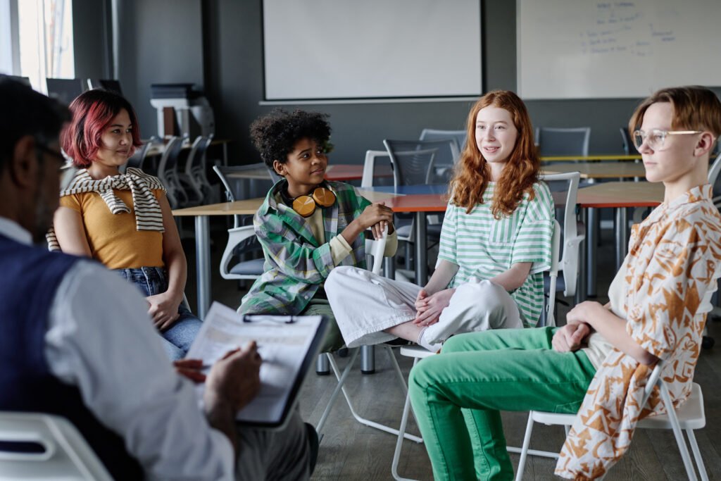 Girl Speaking During Group Therapy Session
