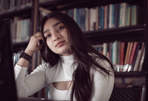 Girl doing homework in the library