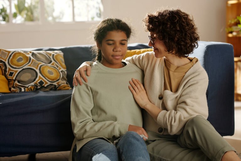 Mom having conversation with her daughter