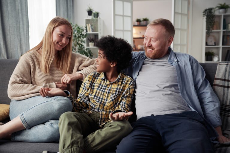 Parents spending time with their adoptive son