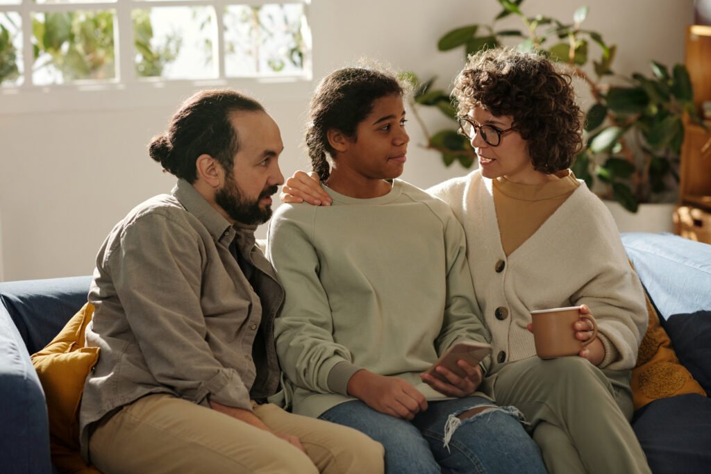 Family talking to adopted daughter