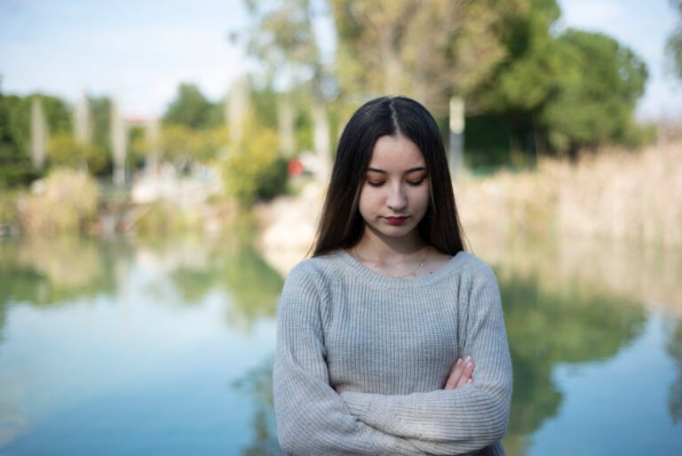 Serious Young Woman With Arms Crossed